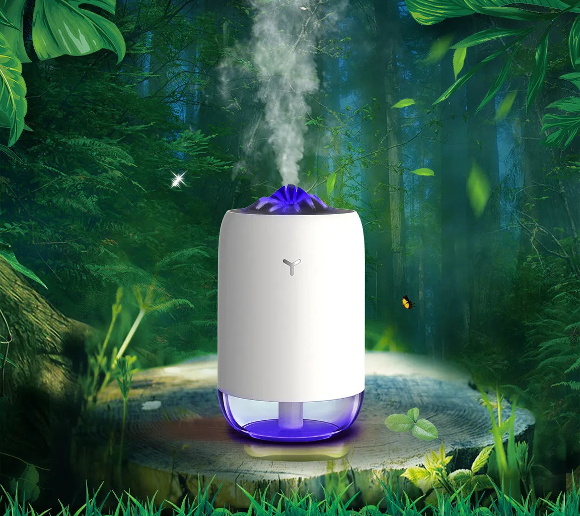 White columnar Magic Flame ultrasonic humidifier with USB cable on a wooden desk