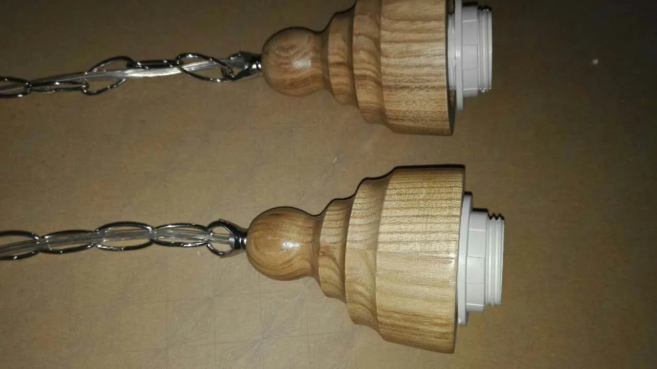 Glass wood grain single head pendant light with adjustable cord on white background