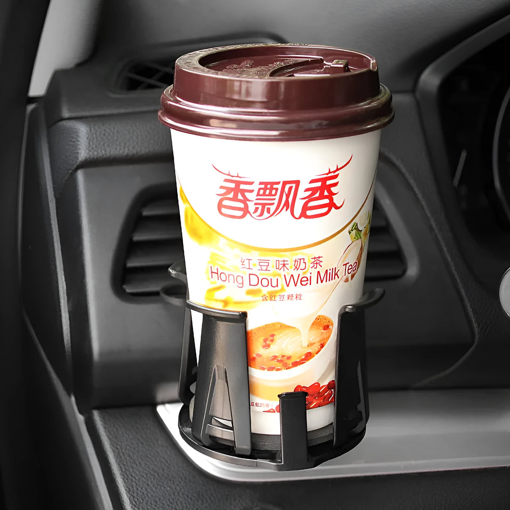 Black universal car air outlet beverage holder made from ABS plastic clipped onto a vehicle vent