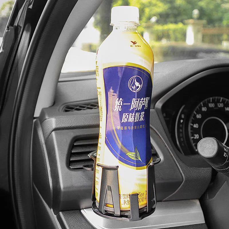 Black universal car air outlet beverage holder made from ABS plastic clipped onto a vehicle vent