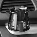 Black universal car air outlet beverage holder made from ABS plastic clipped onto a vehicle vent