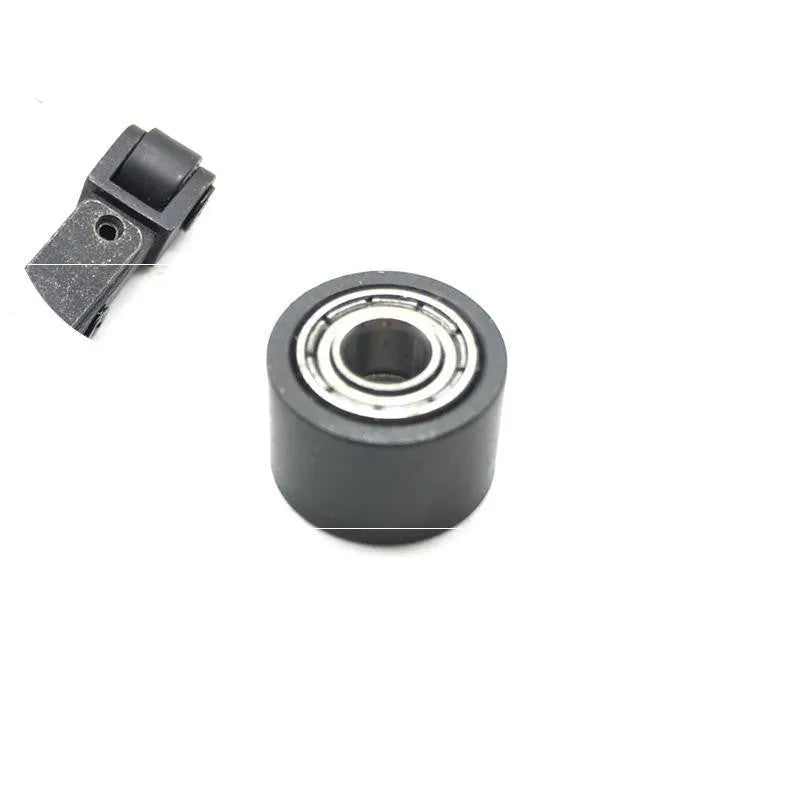 Assortment of pneumatic belt machine spare parts including metal rollers, blades, springs, a switch, and a coupling.