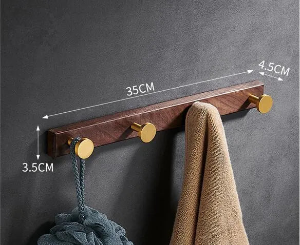 Black walnut bathroom clothes hooks with aluminium frame and brass finish in perforated row design