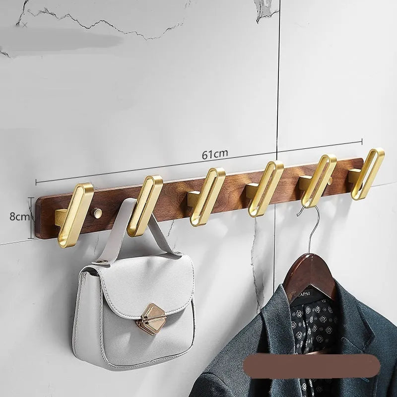 Black walnut bathroom clothes hooks with aluminium frame and brass finish in perforated row design
