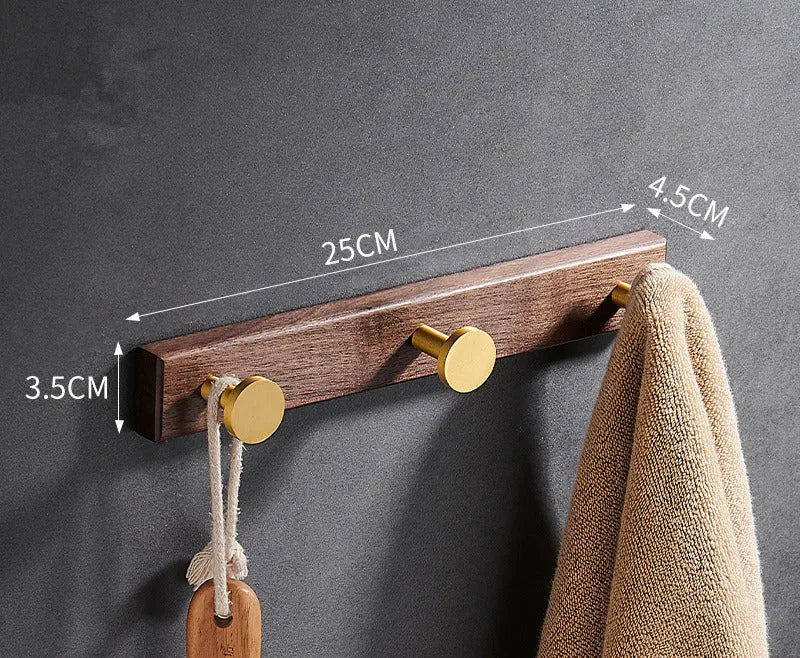 Black walnut bathroom clothes hooks with aluminium frame and brass finish in perforated row design