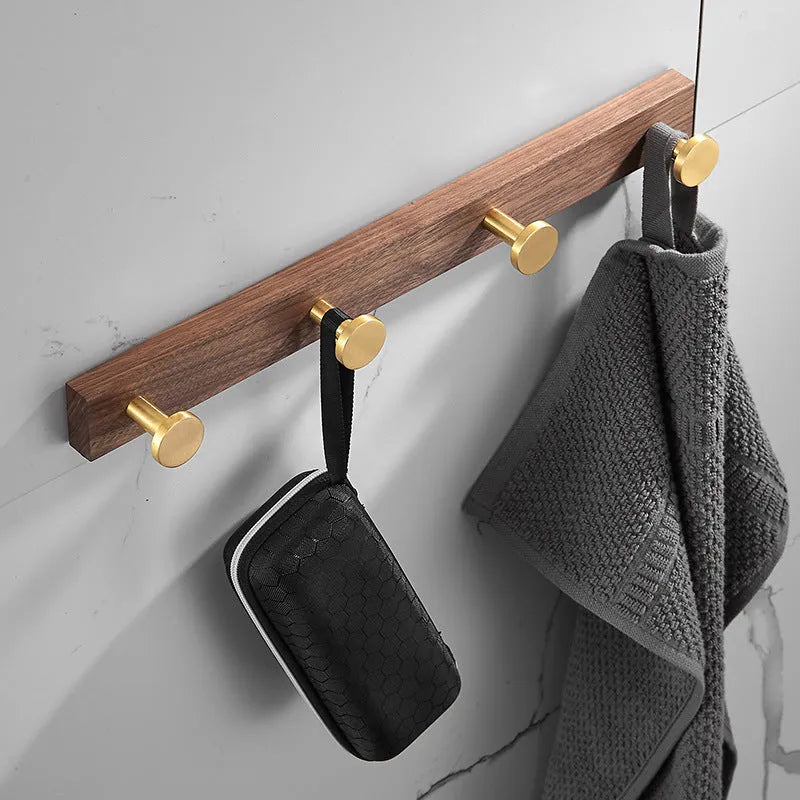Black walnut bathroom clothes hooks with aluminium frame and brass finish in perforated row design