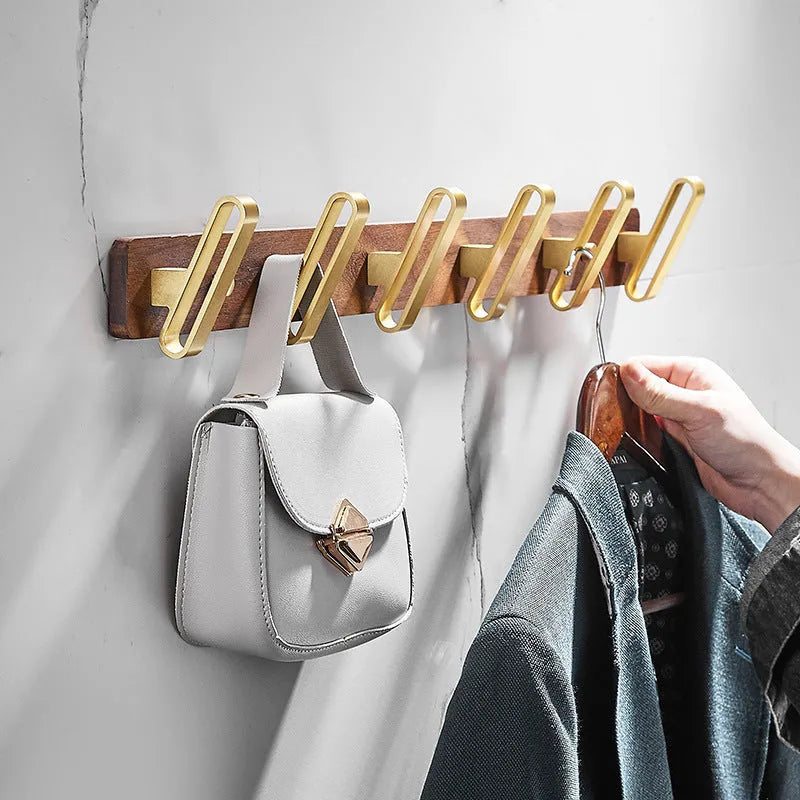 Black walnut bathroom clothes hooks with aluminium frame and brass finish in perforated row design
