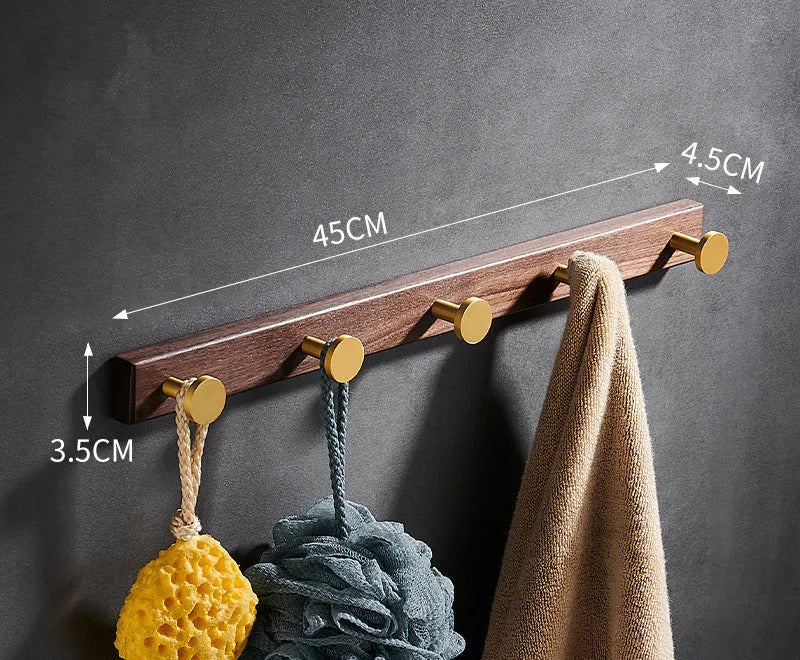 Black walnut bathroom clothes hooks with aluminium frame and brass finish in perforated row design