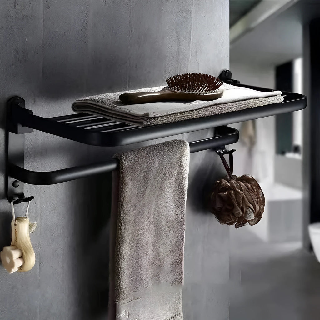 Silver anodised aluminium two-tier folding towel rack mounted on a bathroom wall.