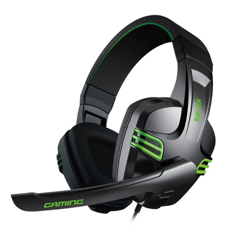 Black wired gaming headset with microphone placed on a desk, 3.5mm plug visible