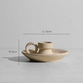 Modern minimalist painted ceramic vase with geometric shape, handmade pottery ornament on shelf