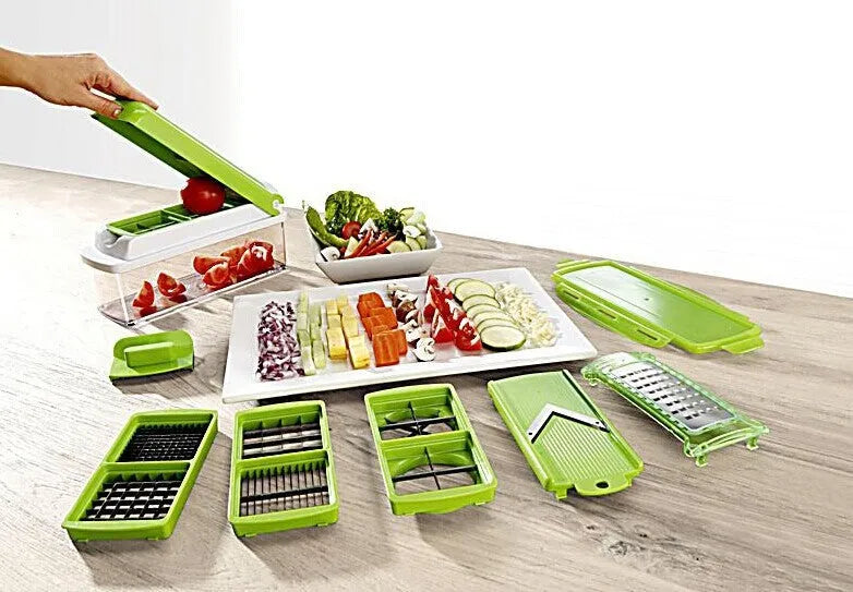 Green manual vegetable chopper with stainless steel blades on a kitchen counter