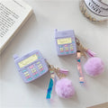 Purple silicone clamshell case for Apple AirPods with a small fur ball pendant attached.