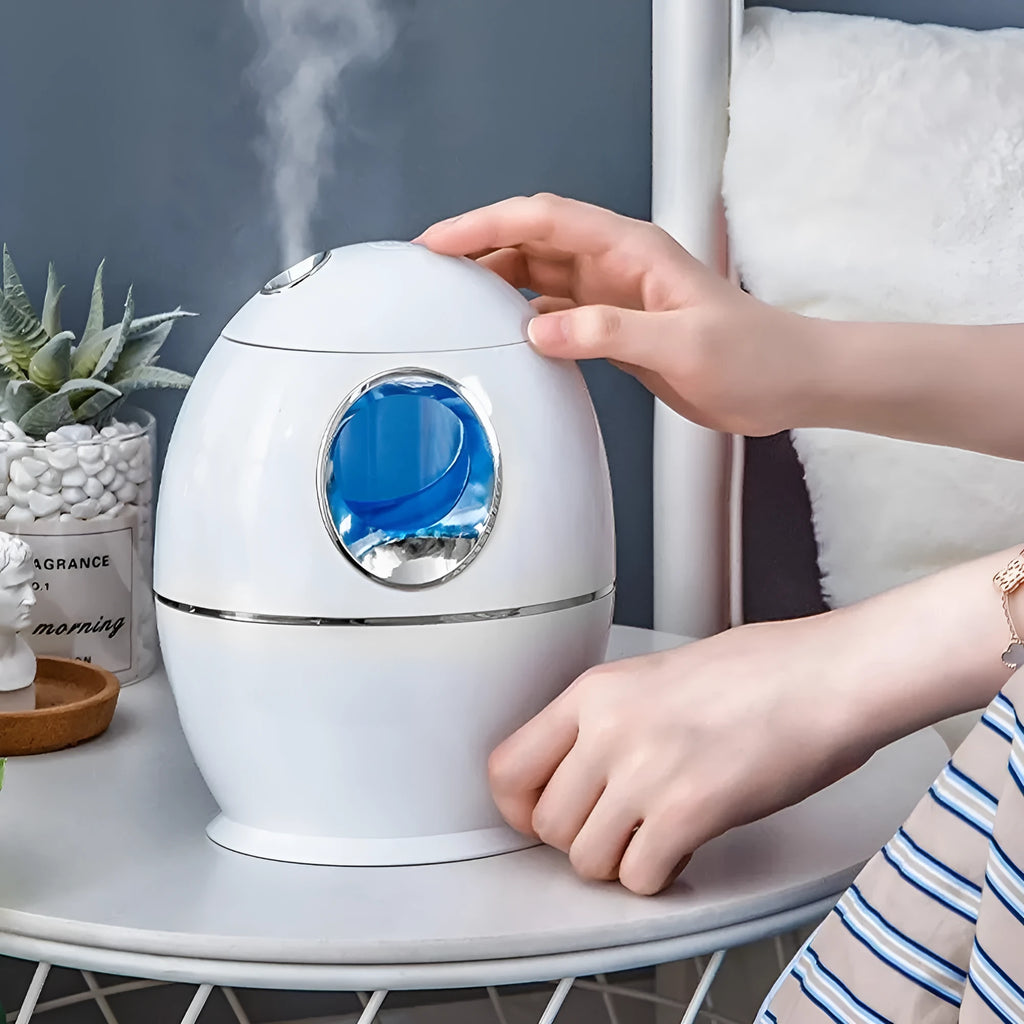 Small round white aromatherapy humidifier with USB cable and water mist emission