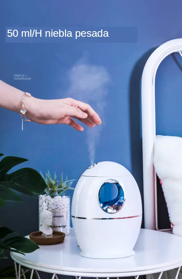 Small round white aromatherapy humidifier with USB cable and water mist emission