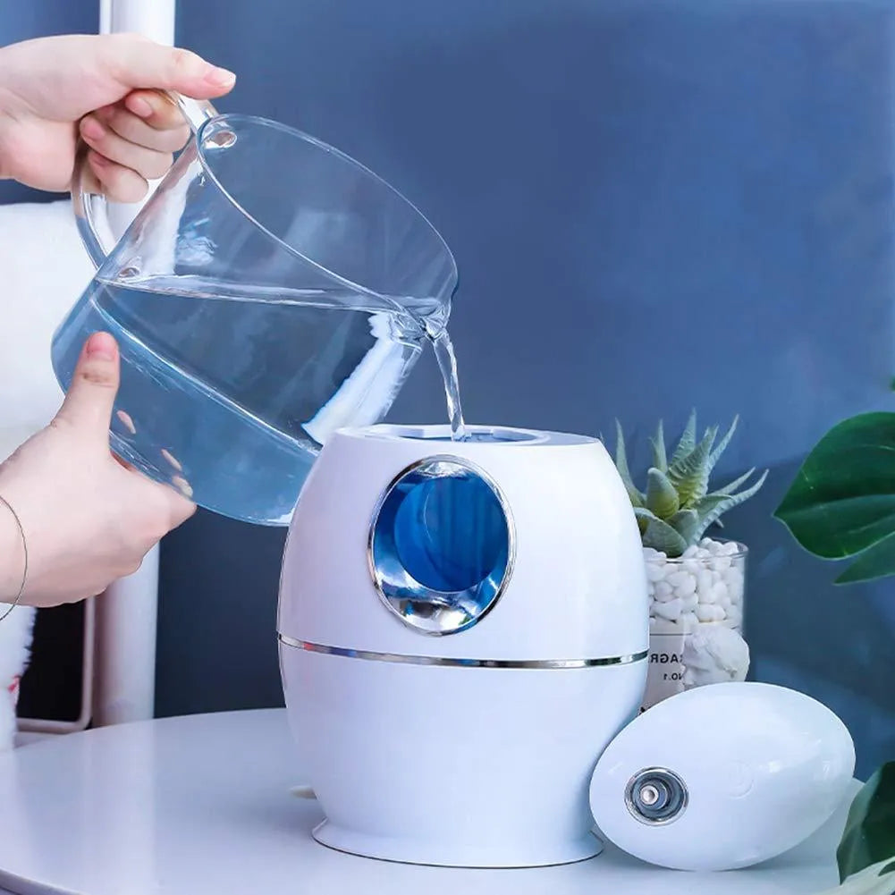 Small round white aromatherapy humidifier with USB cable and water mist emission