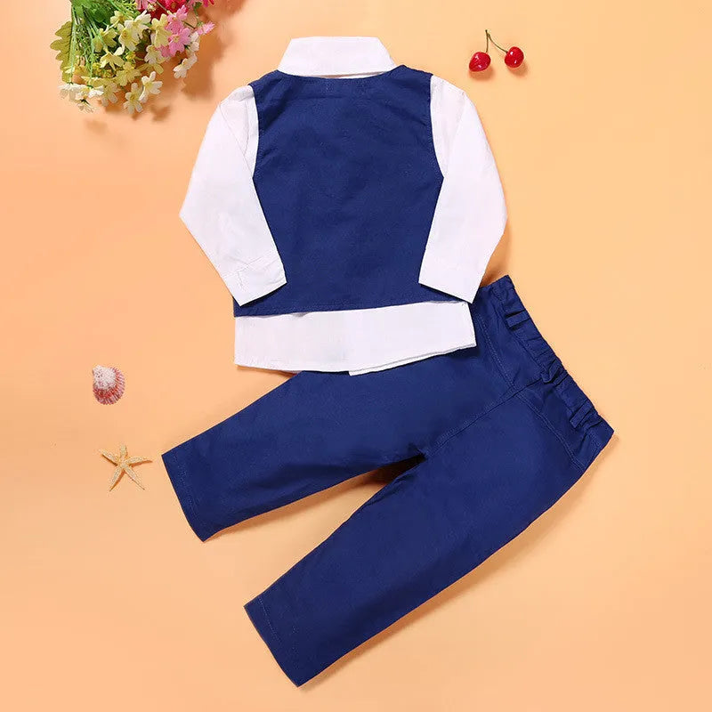 Blue boys' suit set with turtleneck, waistcoat, tie, and trousers on a hanger.
