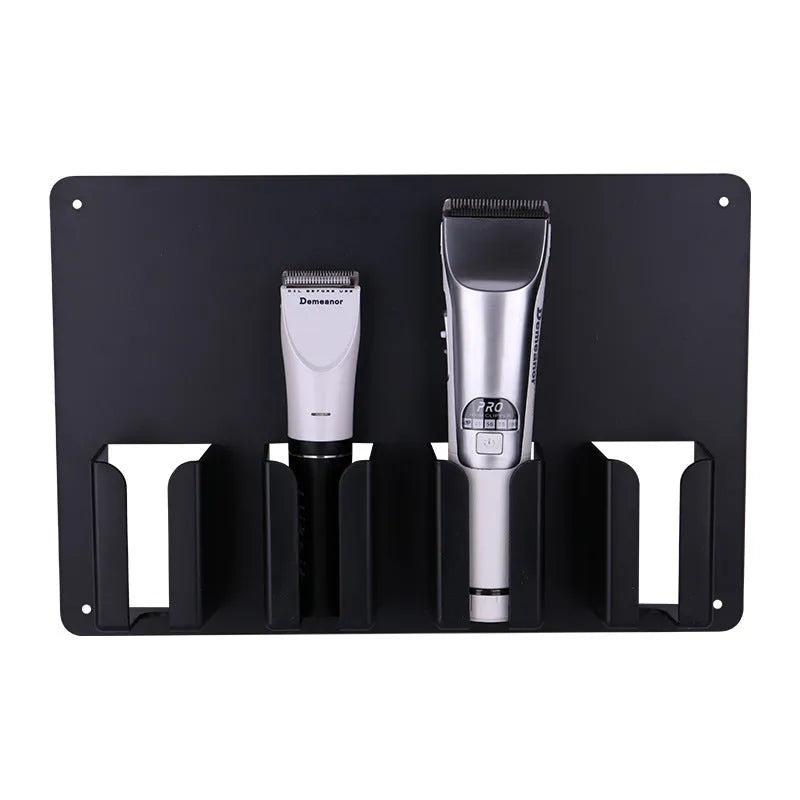 Black plastic wall-mounted frame holding four hair clippers and a hair dryer for salon storage.