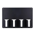 Black plastic wall-mounted frame holding four hair clippers and a hair dryer for salon storage.