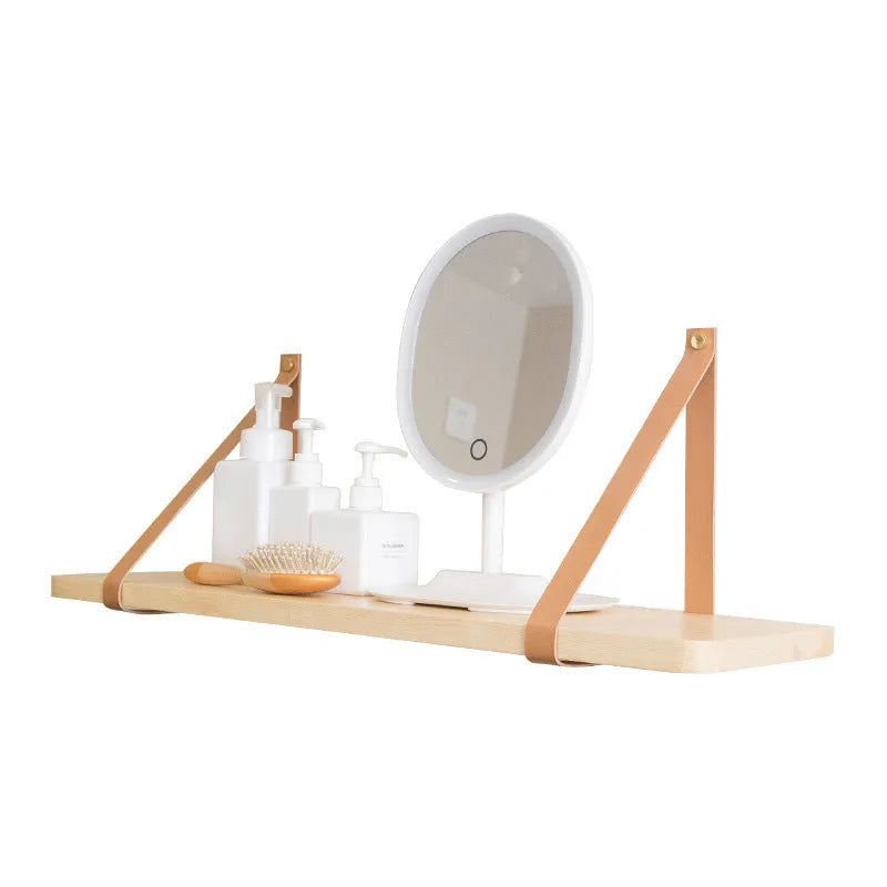 Pine wood wall-mounted storage shelf, 50cm wide by 16cm high, holding books and cosmetic items.