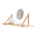 Pine wood wall-mounted storage shelf, 50cm wide by 16cm high, holding books and cosmetic items.
