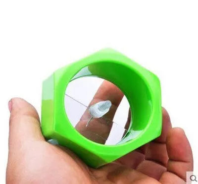 Yellow and green food-grade ABS plastic spiral vegetable cutter on a kitchen counter