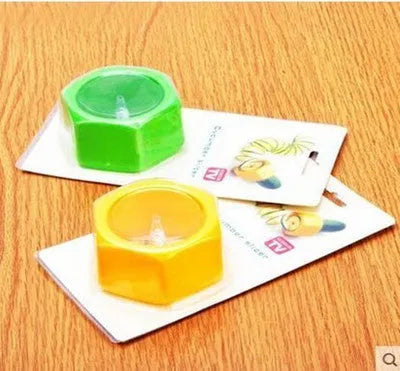 Yellow and green food-grade ABS plastic spiral vegetable cutter on a kitchen counter