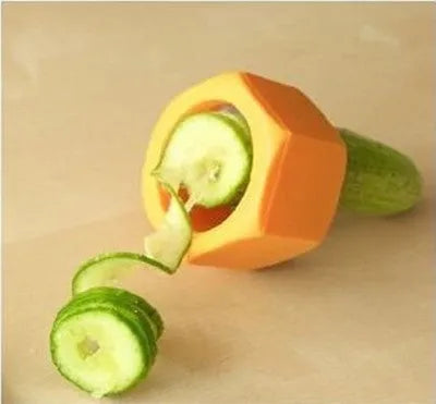 Yellow and green food-grade ABS plastic spiral vegetable cutter on a kitchen counter