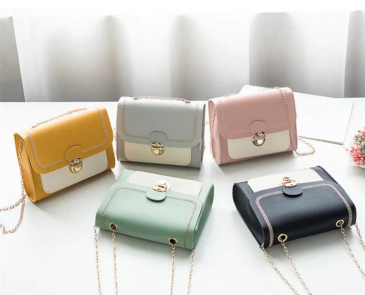 Small horizontal square PU chain shoulder bag with lock closure in yellow colour