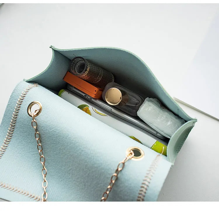 Small horizontal square PU chain shoulder bag with lock closure in yellow colour