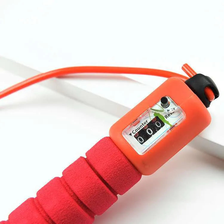 Adult skipping rope with a digital counter on the handle, sponge grip, and plastic rope on a white background