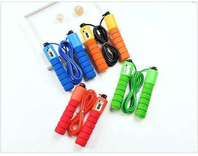 Adult skipping rope with a digital counter on the handle, sponge grip, and plastic rope on a white background