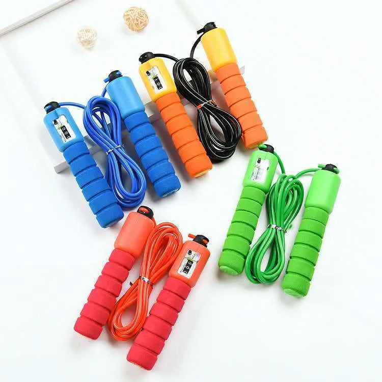 Adult skipping rope with a digital counter on the handle, sponge grip, and plastic rope on a white background