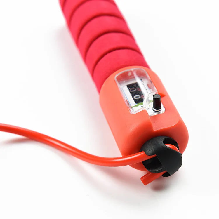 Adult skipping rope with a digital counter on the handle, sponge grip, and plastic rope on a white background
