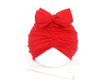Soft knitted acrylic baby turban hat for newborns to toddlers in a solid pink colour.