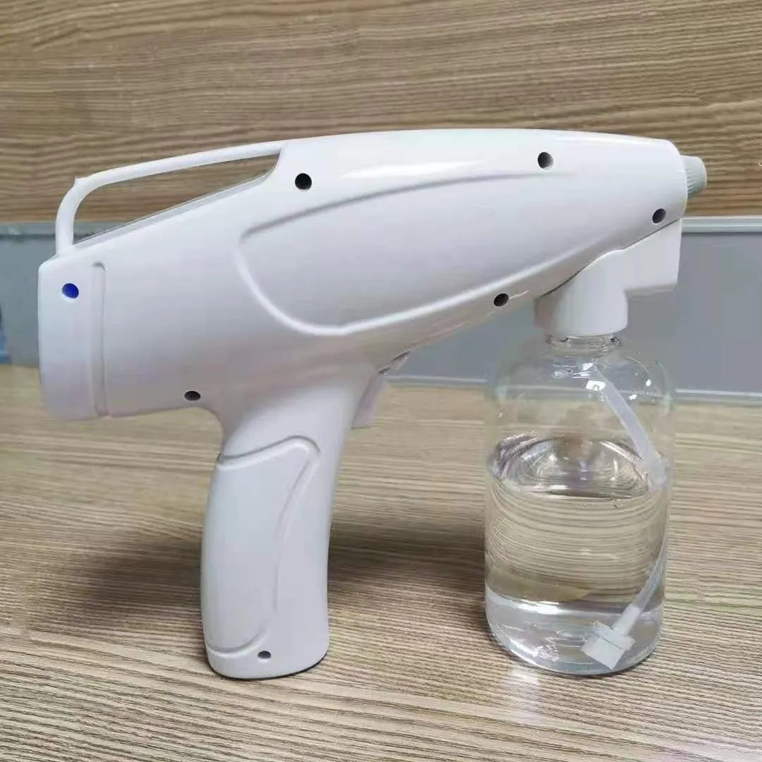 White handheld wireless electric spray disinfection gun with USB cable