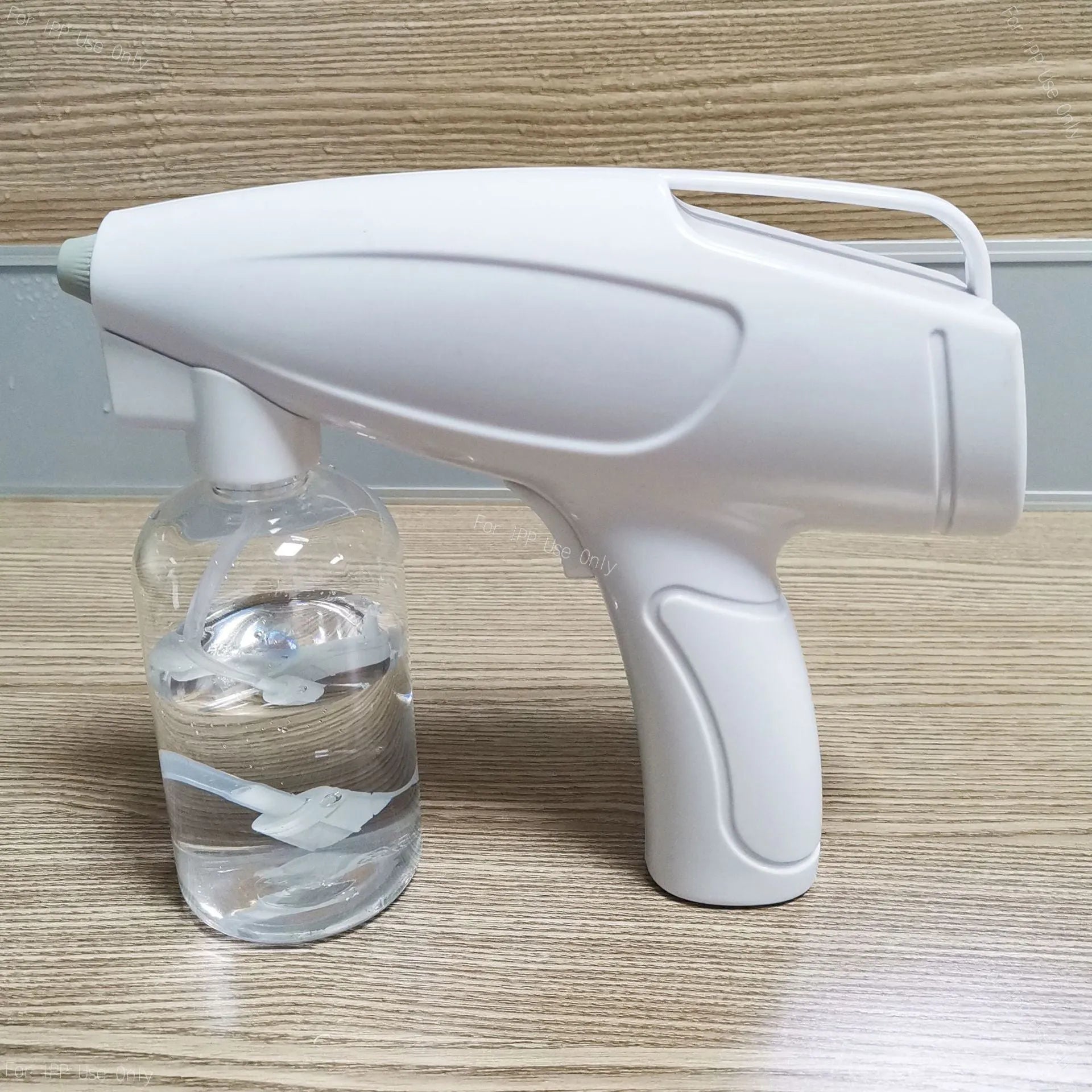 White handheld wireless electric spray disinfection gun with USB cable