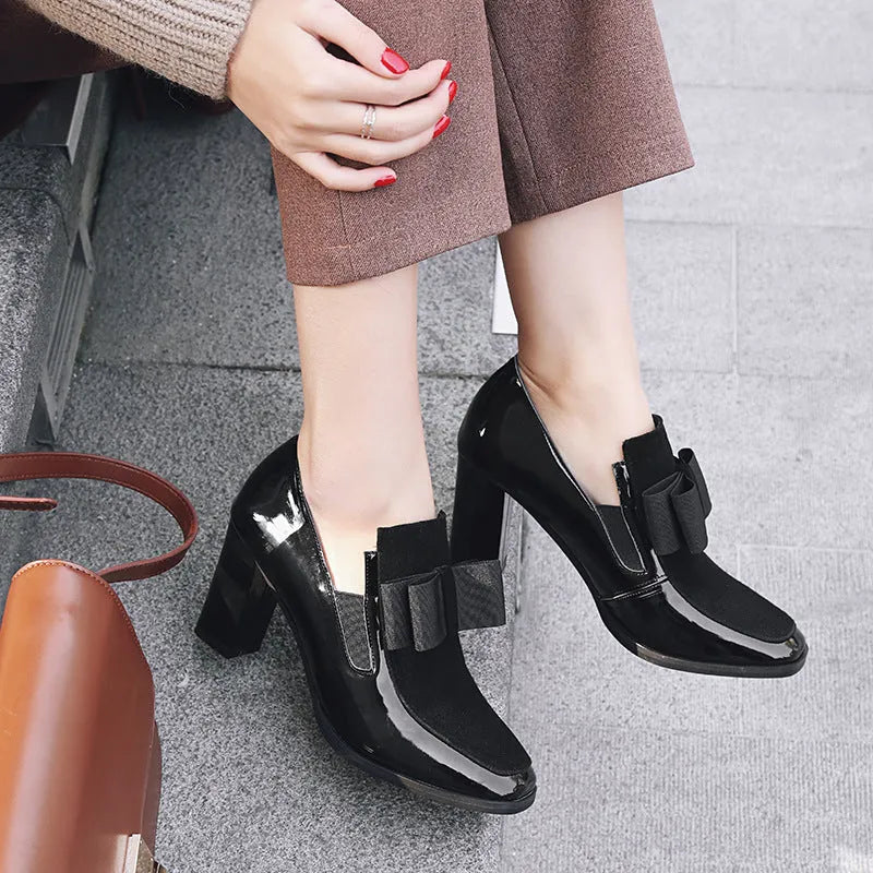 Black patent leather women's high heels with a thick 8cm heel and square toe.