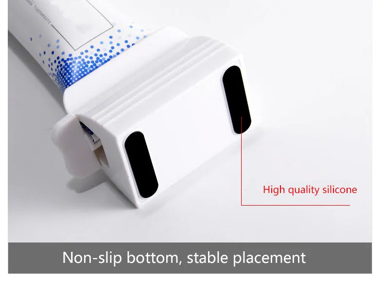 Large white ABS plastic toothpaste squeezer with red accents, used to squeeze toothpaste tubes flat