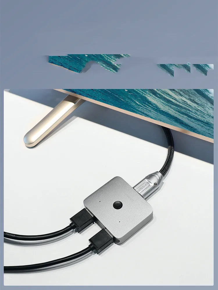 Grey HDMI switcher with two input ports and one output port for sharing displays between devices