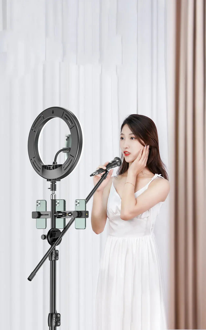 Carbon alloy mobile phone live tripod with a ring light attached, shown with a storage bag.