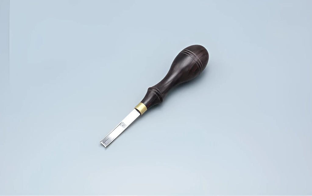 Wide shovel edge thinning knife hand tool with leather handle and drum shovel design