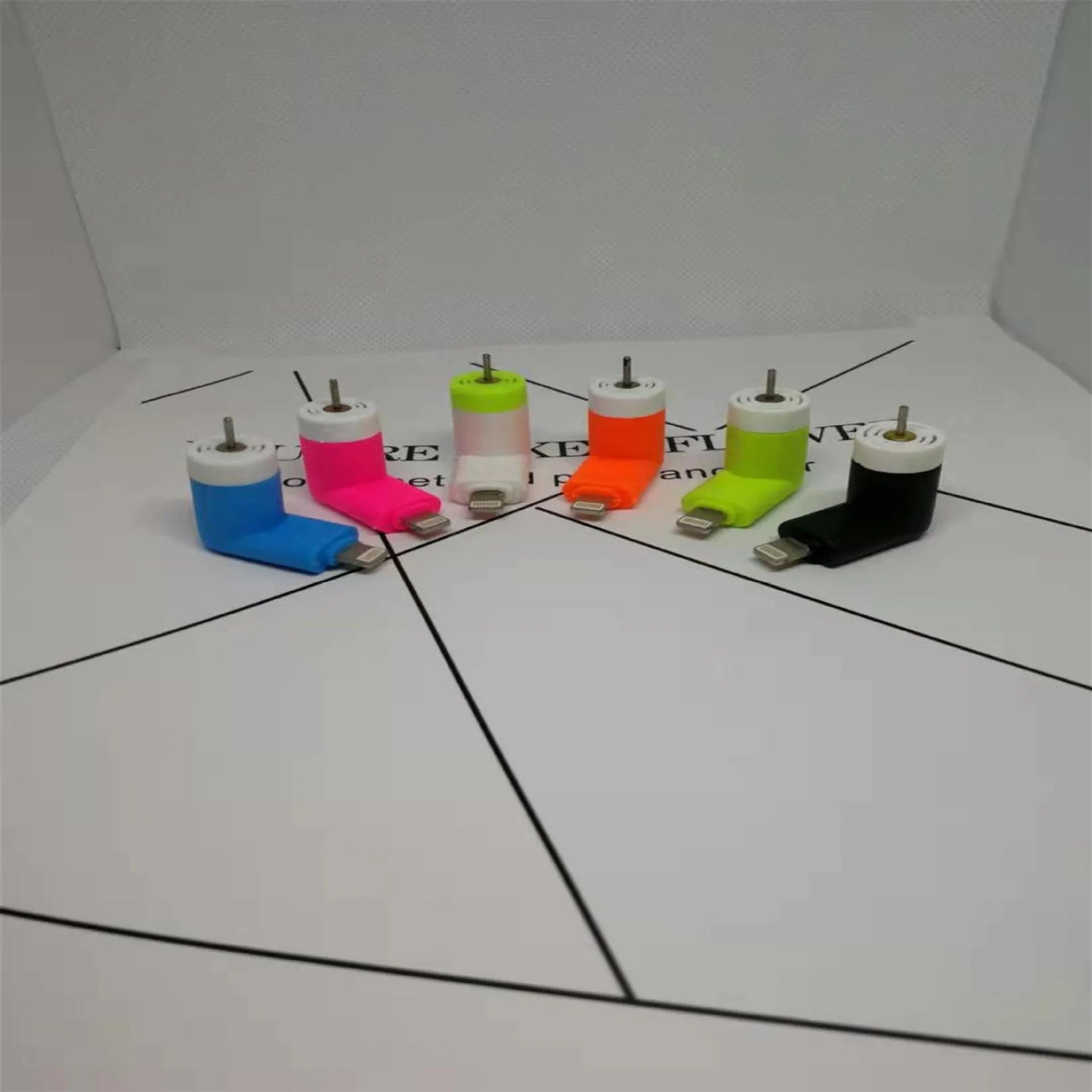 Portable mobile phone mini fan with plastic blades and rotary switch in multiple colours.