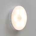 Two wireless motion sensor LED lights for installation inside cabinets or hallways.
