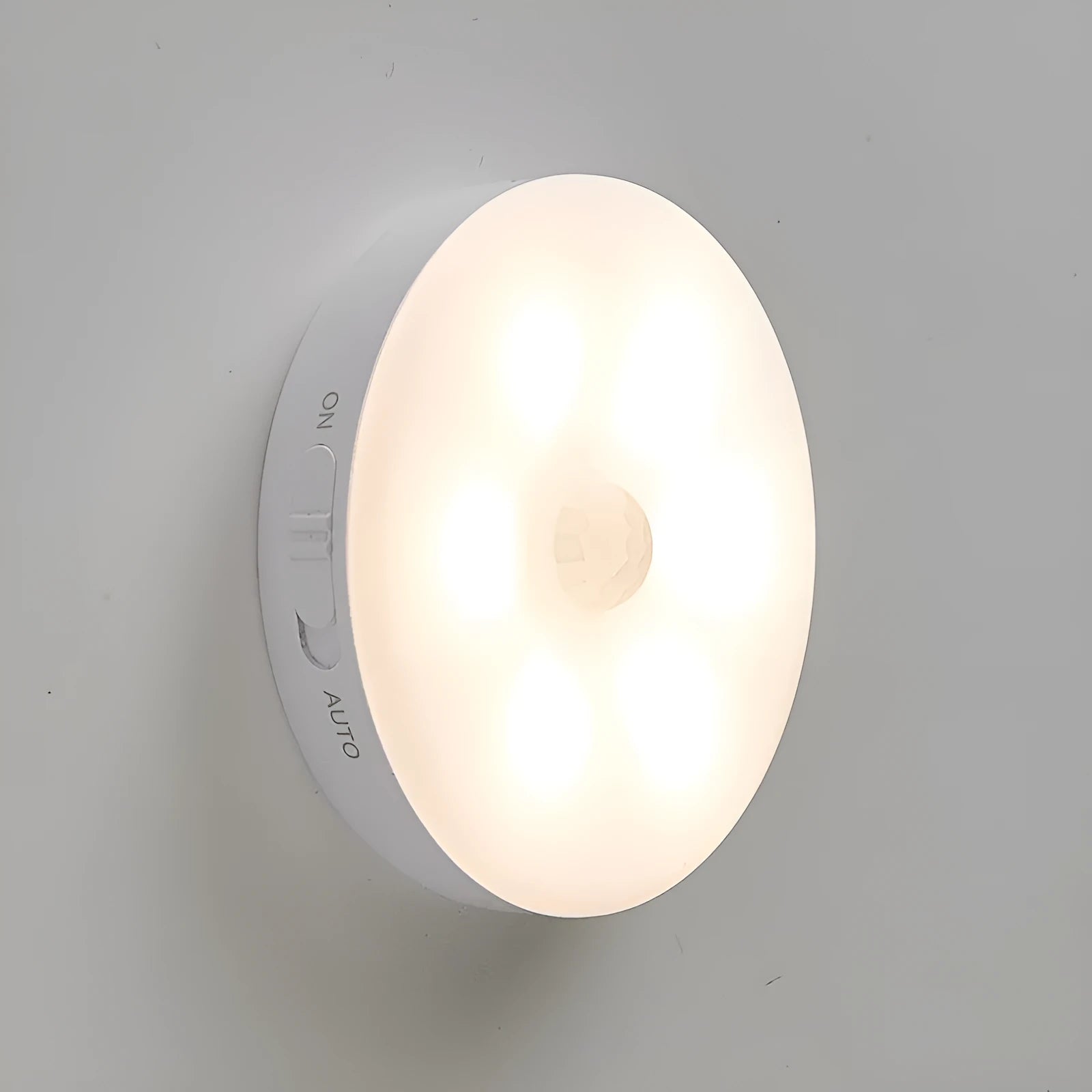 Two wireless motion sensor LED lights for installation inside cabinets or hallways.
