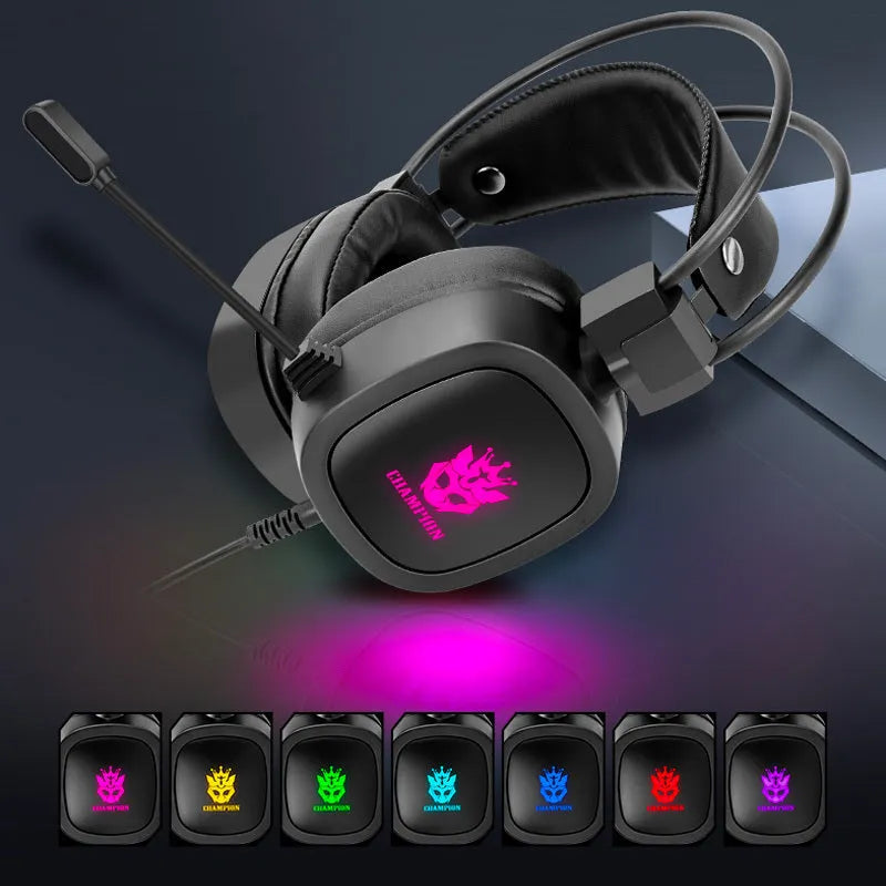 Black wired gaming headset with microphone and sponge ear cushions on a desk