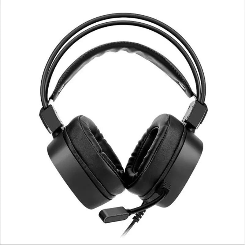 Black wired gaming headset with microphone and sponge ear cushions on a desk