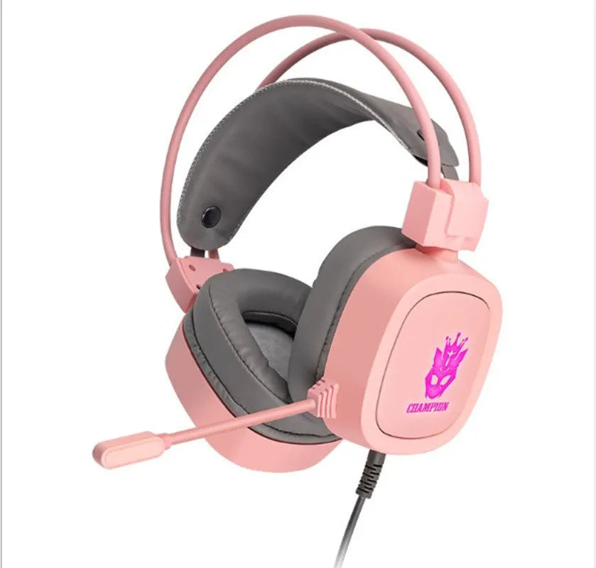 Black wired gaming headset with microphone and sponge ear cushions on a desk