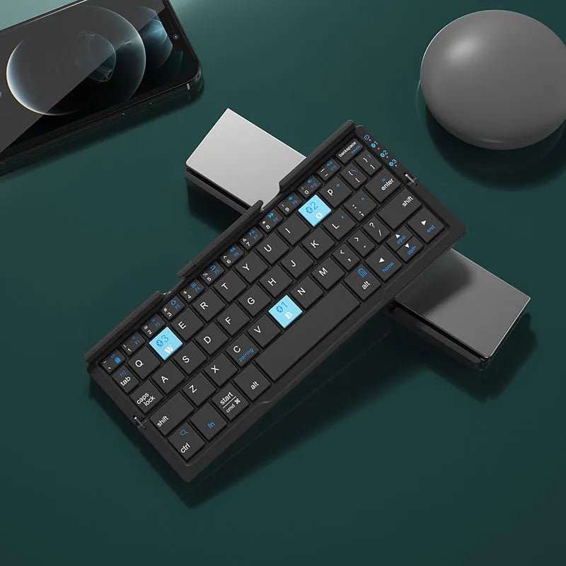 Silver white aluminium folding Bluetooth keyboard open with phone in stand showing 60-key layout