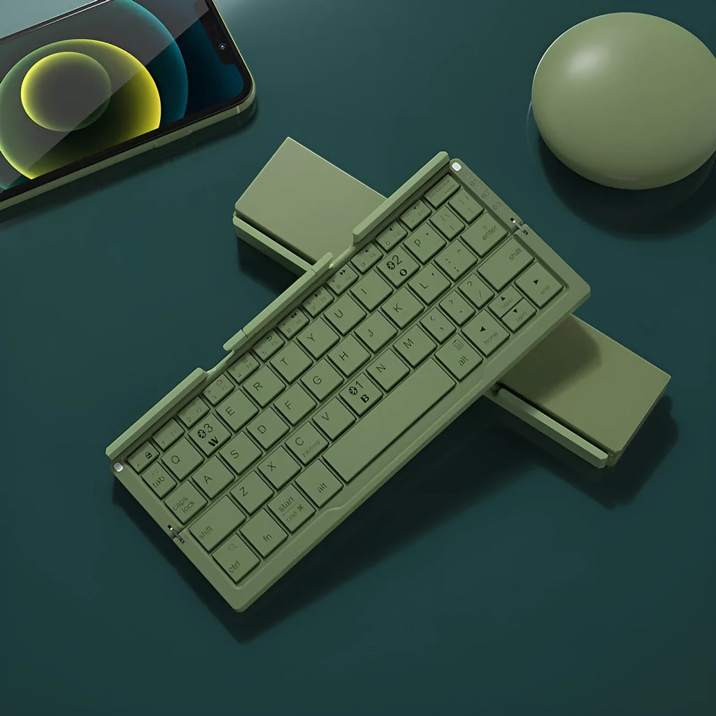 Silver white aluminium folding Bluetooth keyboard open with phone in stand showing 60-key layout